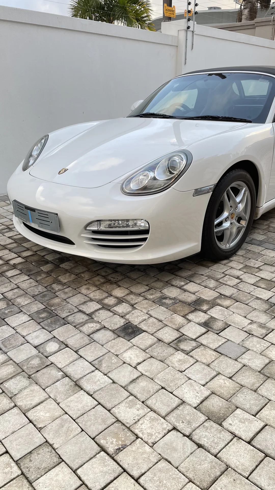 White Porsche convertible with a clean gloss finish